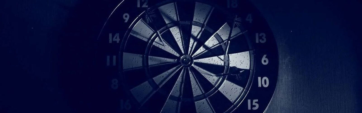 Black and white photo of a dartboard that's used for precision darts blog posts. 